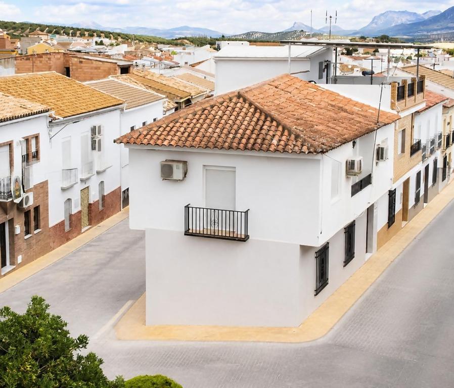 a view of a city street with white buildings at Casa Arcadia Centro de Andalucía in Encinas Reales
