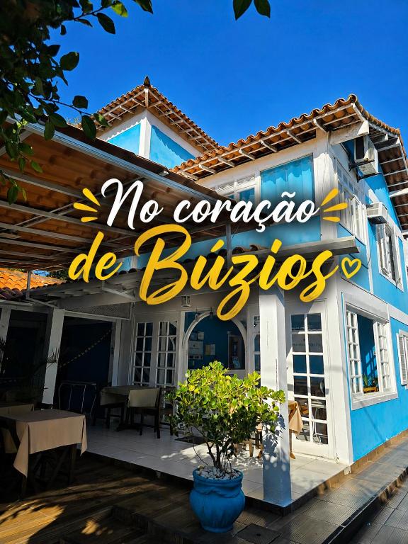 a building with a sign that reads no concordia de busolis at Pousada Turquesa By Gente Bonita in Búzios