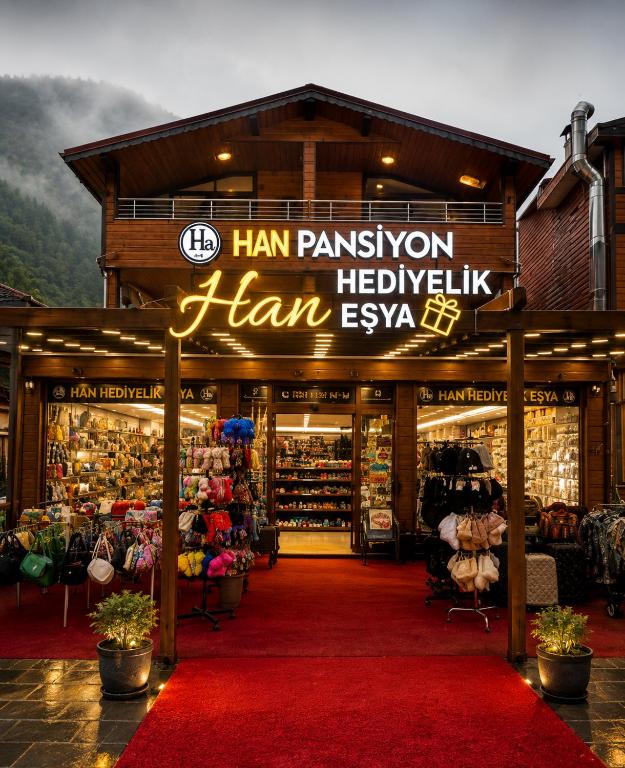 a store with a red carpet in front of a store at Han PANSİYON in Çaykara
