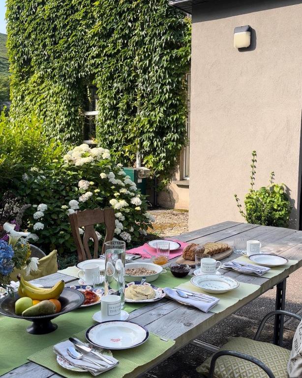 a wooden table with food on top of it at The Old Monastery Guesthouse in Cahersiveen