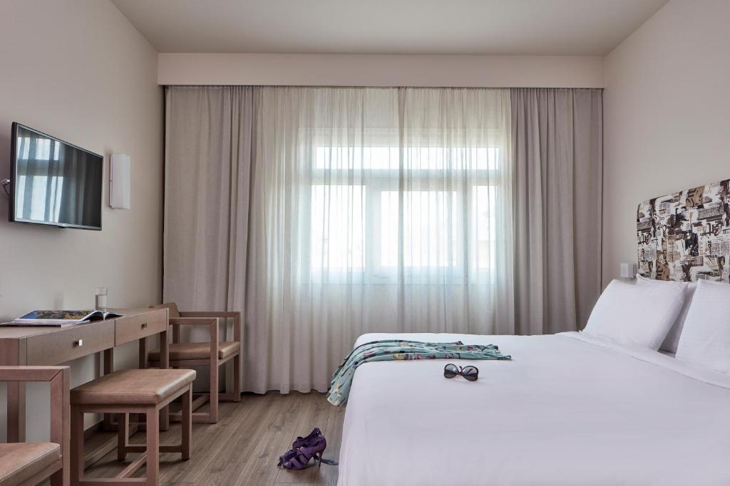 Postel nebo postele na pokoji v ubytování Civitel Esprit