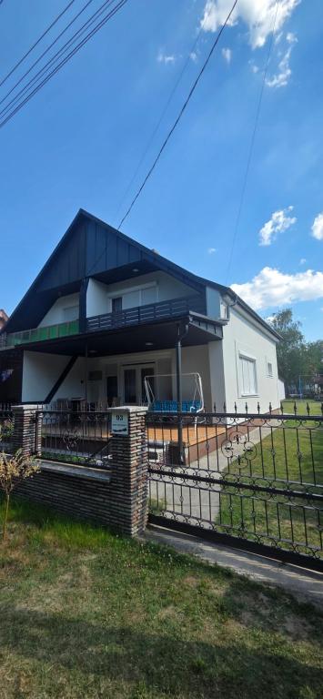 a house with a black roof at Mária 93 in Balatonmáriafürdő
