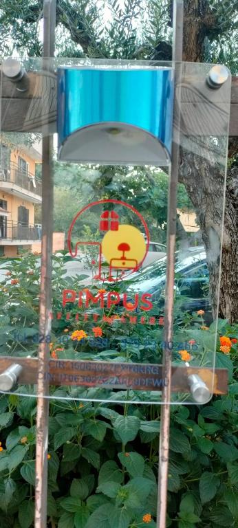a blue chair in a garden with flowers at Pimpus in Cicciano
