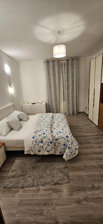 a bedroom with a bed and a large window at La dimora di Gabi in Marghera