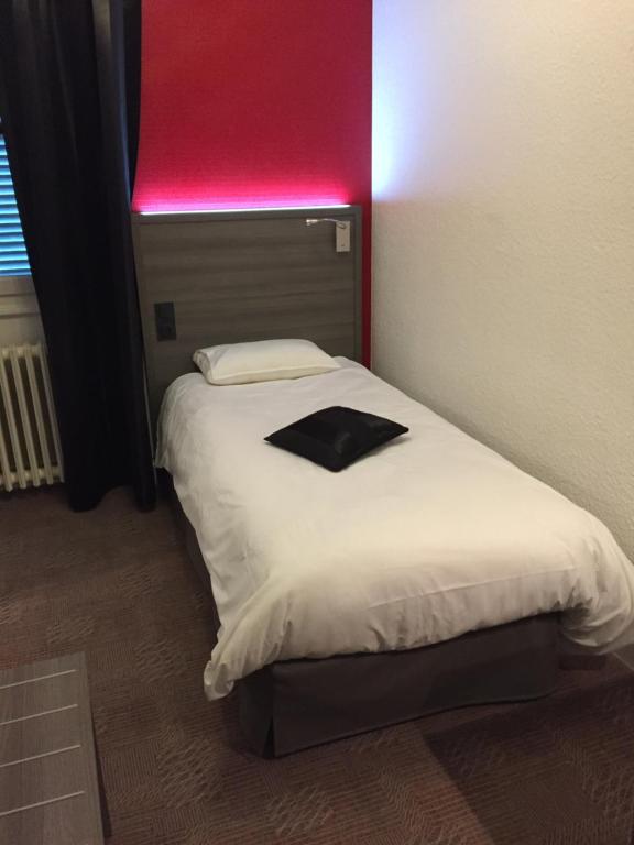 Postel nebo postele na pokoji v ubytování Le Beverl'inn