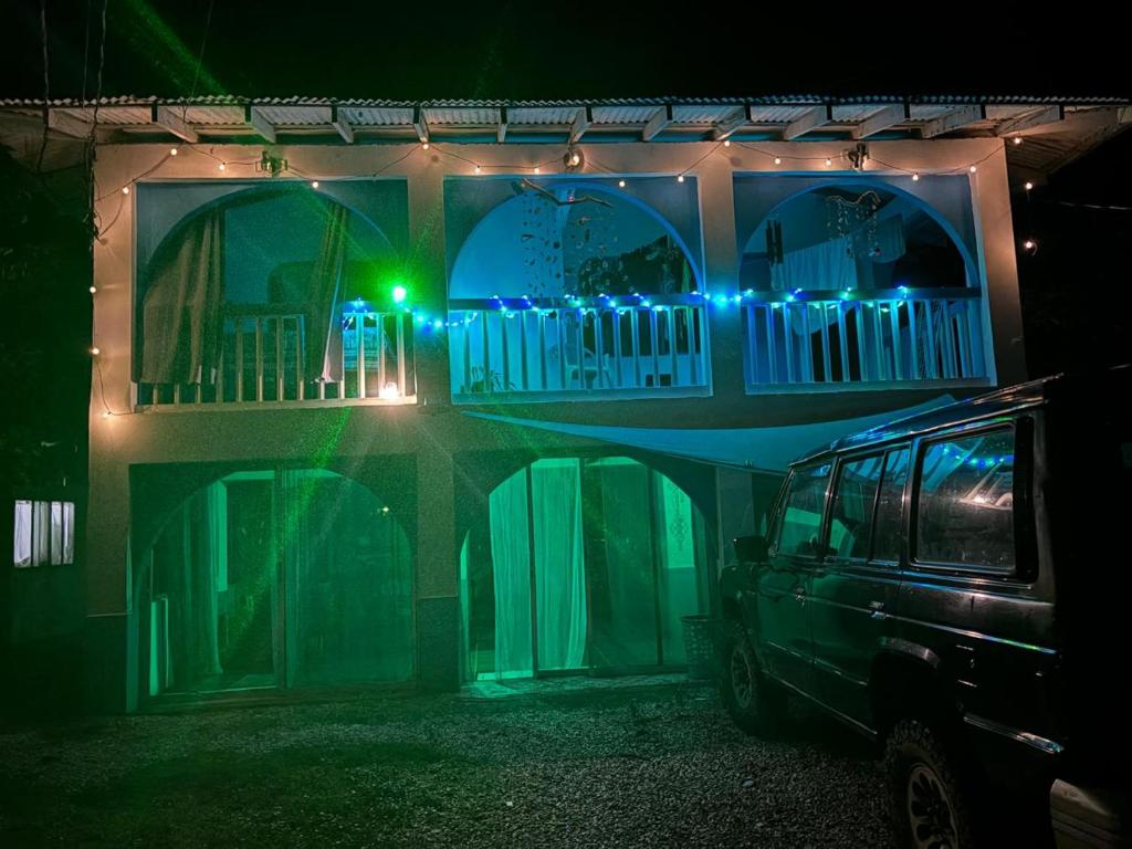 a house with a car parked in front of it at night at Casa Azul by Silvia Sàmara in Nicoya