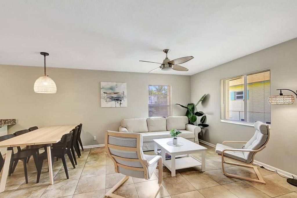 a living room with a couch and a table at 2 BR Home Close to The Beach in Lantana