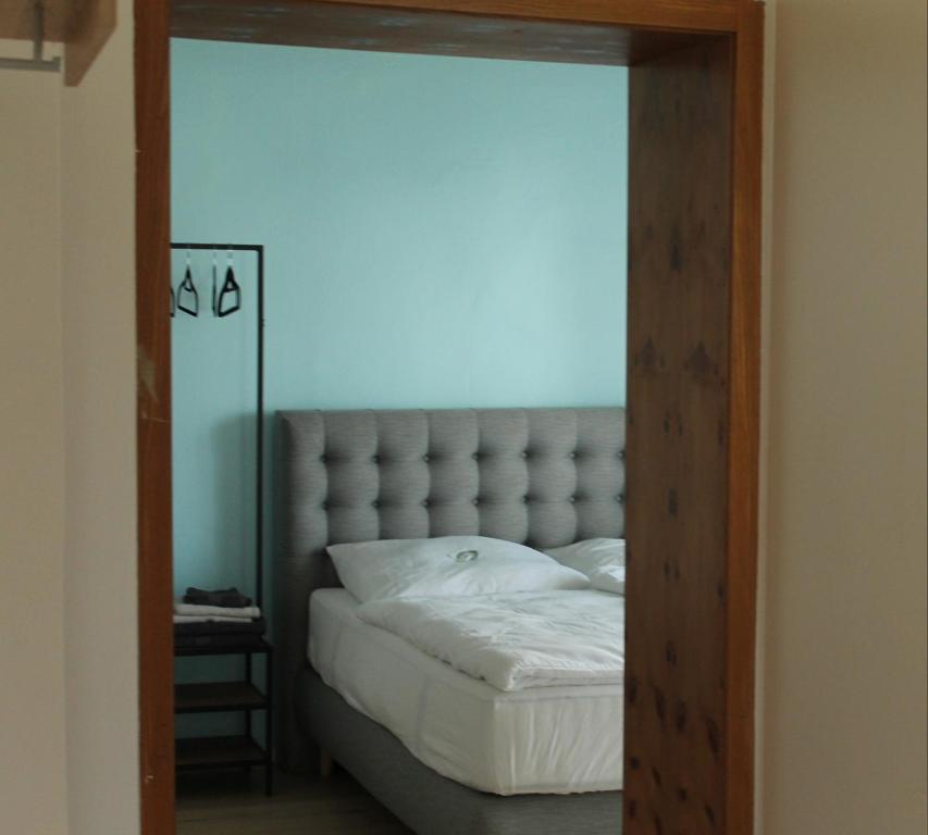 a bedroom with a large bed with a large mirror at Royal Racing Suite Top 4 near Red Bull Ring in Judenburg