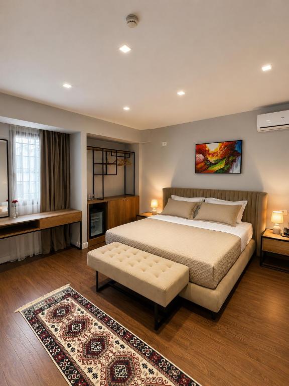 a large bedroom with a large bed and a rug at 313 Villa City Center in Tirana