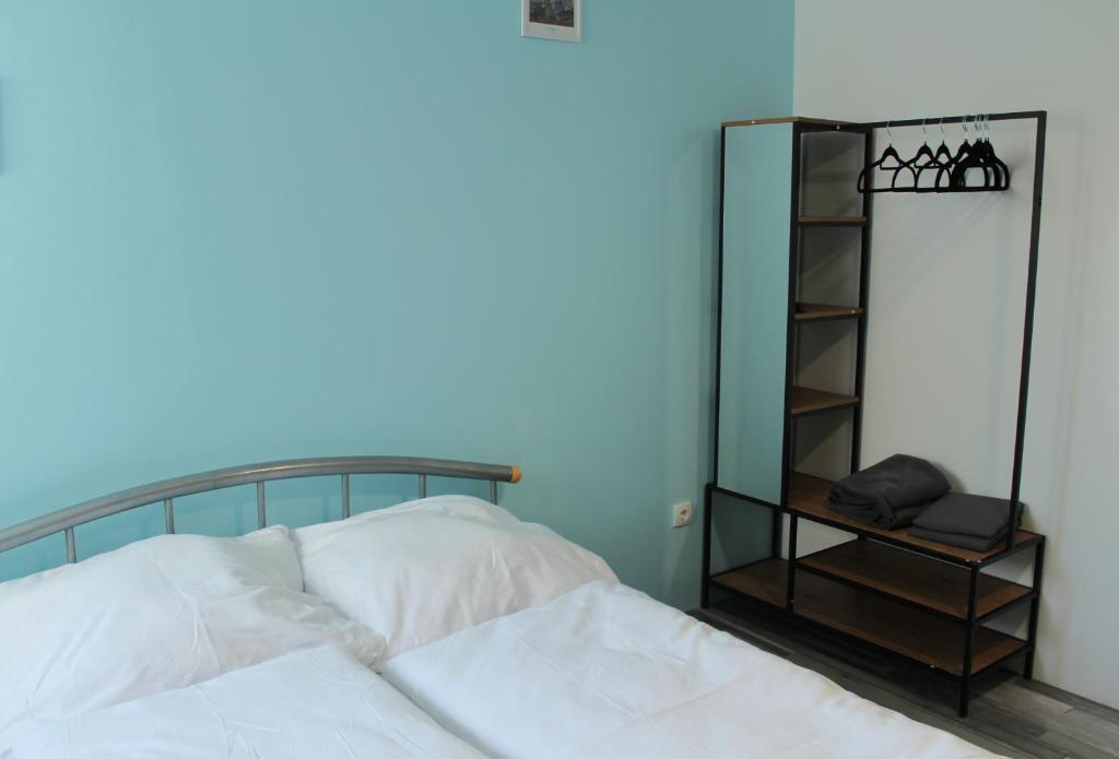 a bedroom with a white bed and a mirror at Royal Racing Suite Top 5 near Red Bull Ring in Judenburg