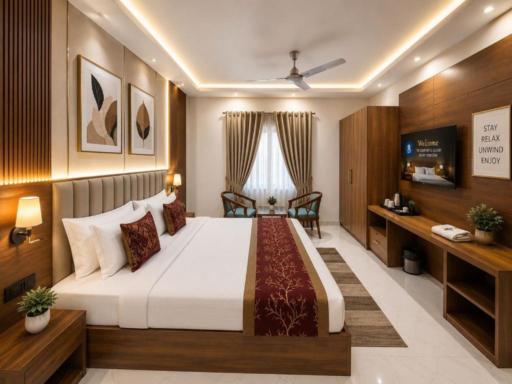 a hotel room with a bed and a television at Hotel Montanaa Plaza Near Delhi Airport - Free Airport Pickup & Drop and Breakfast- Dinner complementary in New Delhi