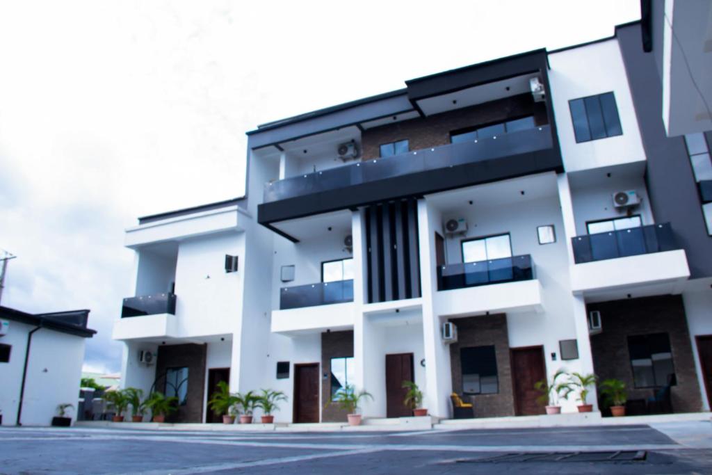 a white building with a lot of windows at Dream Nest in Benin City