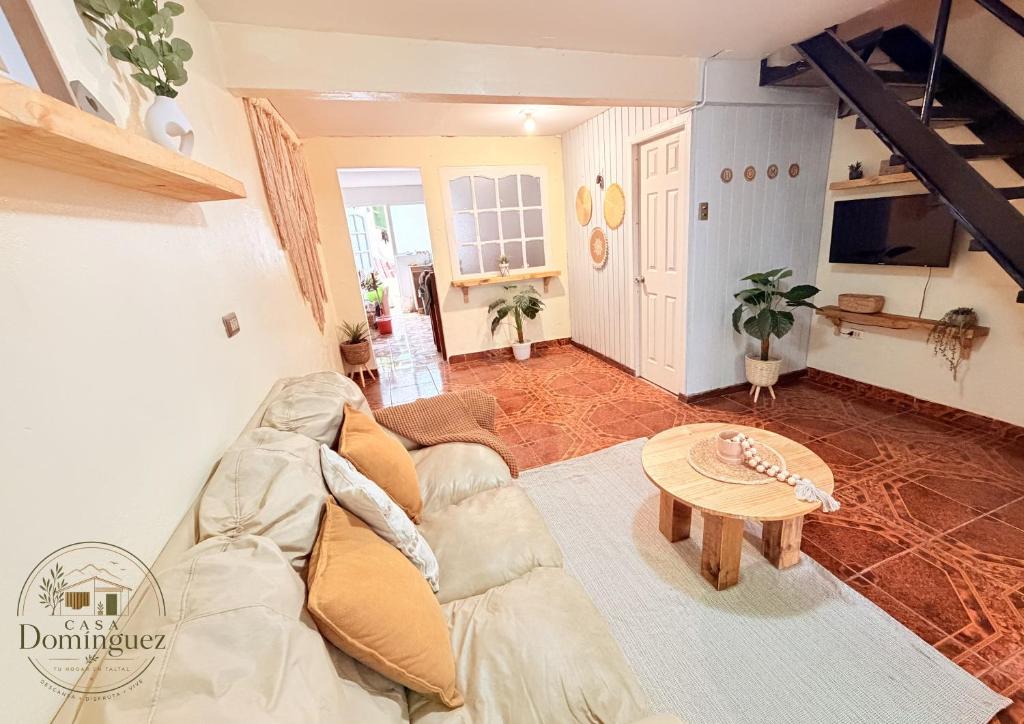 a living room with a couch and a table at Taltal - Casa Dominguez in Taltal