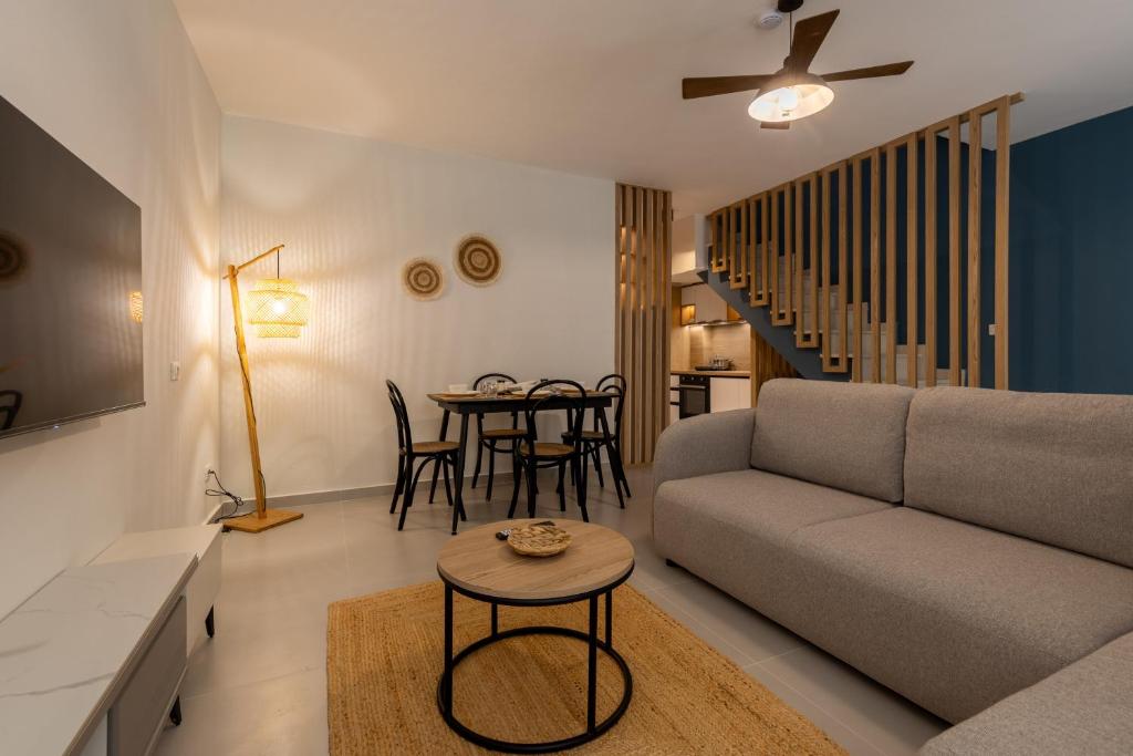 a living room with a couch and a table at D'stay by Dastid in Golem