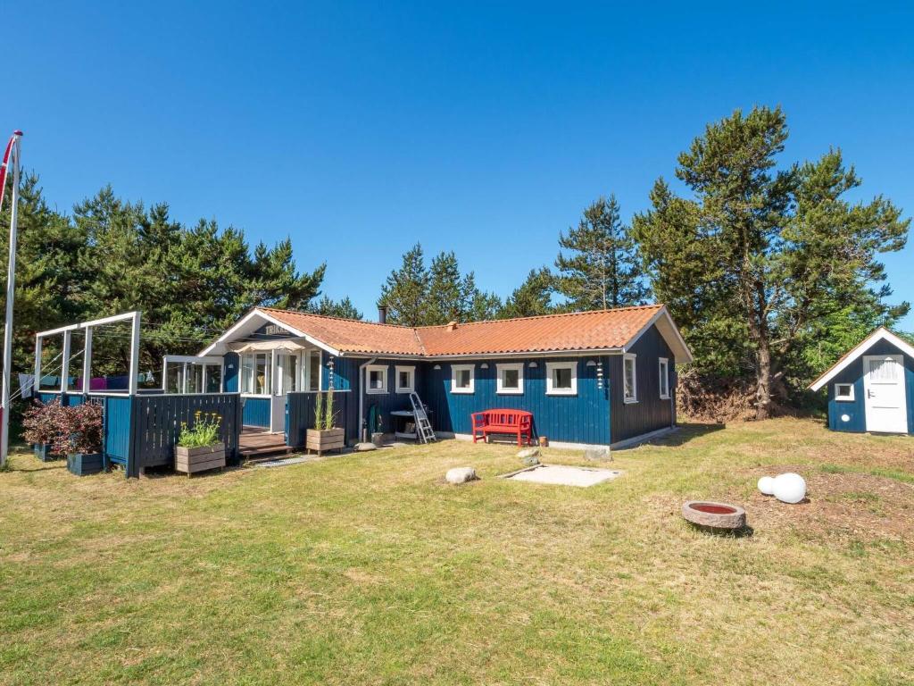 a tiny house in a yard with a playground at 6 person holiday home in Thisted in Thisted