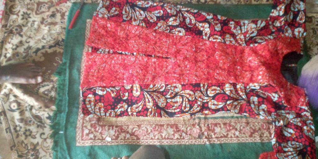 a close up of a red and green quilt at Oussoumana in Matamey