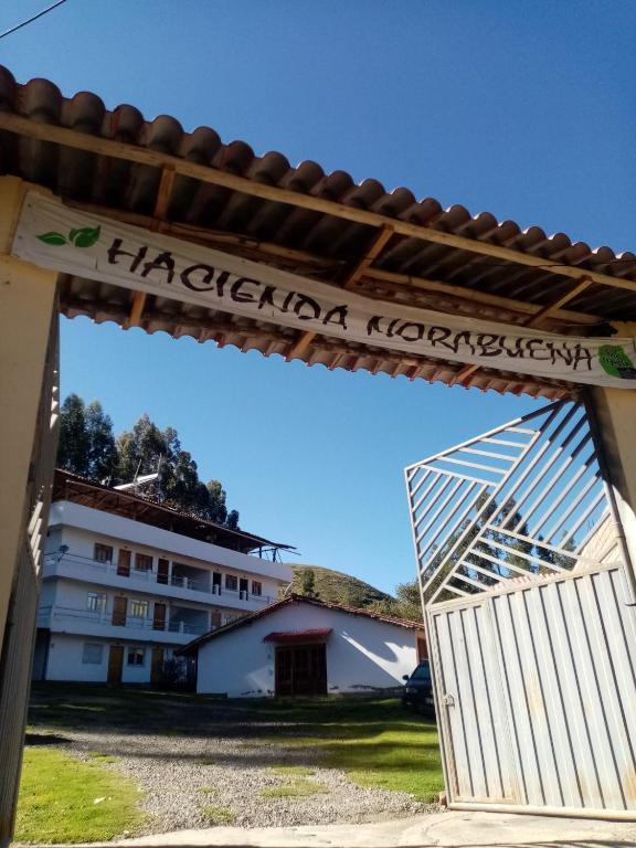 a gate to a building with a sign that reads imperial korea at Hospedaje Hacienda Norabuena in Recuay