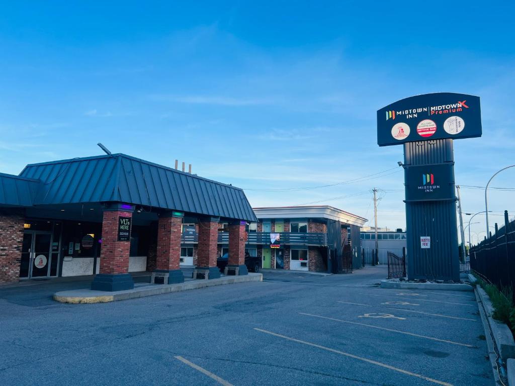 an empty parking lot in front of a gas station at Midtown Inn SSK in Saskatoon