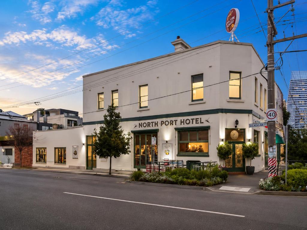 a white building on a street with an event room hotel at Heritage-Style Boutique Hotel, Port Melbourne in Melbourne