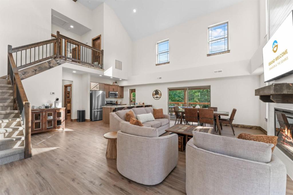 a living room with couches and a fireplace at Lumberjack Lodge with Amenities in Hollister