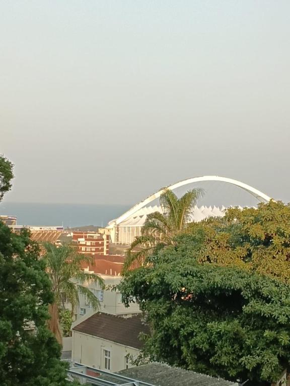 a view of a city with a large white arch at Corfield in Durban