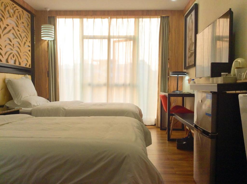 Postel nebo postele na pokoji v ubytování Guangzhou Bird Island Hotel