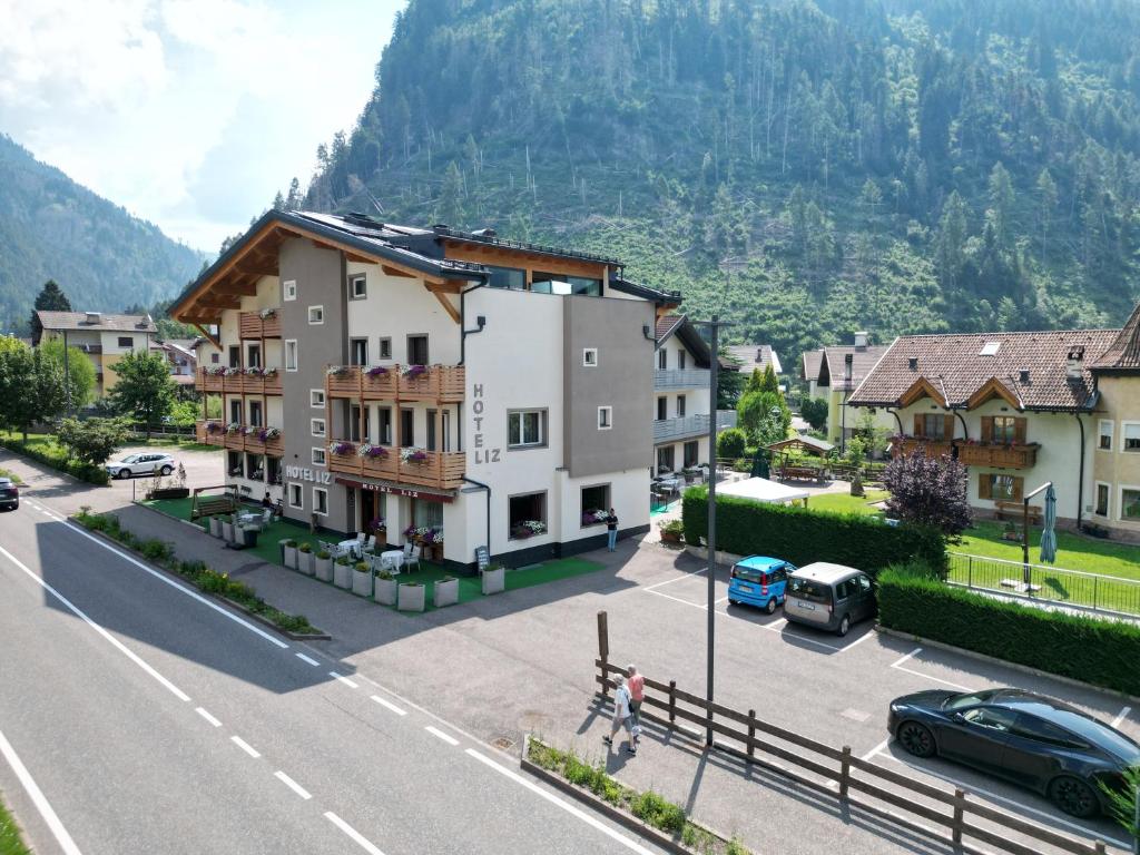 a view of a town with a mountain at Liz Hotel & Apartments in Predazzo