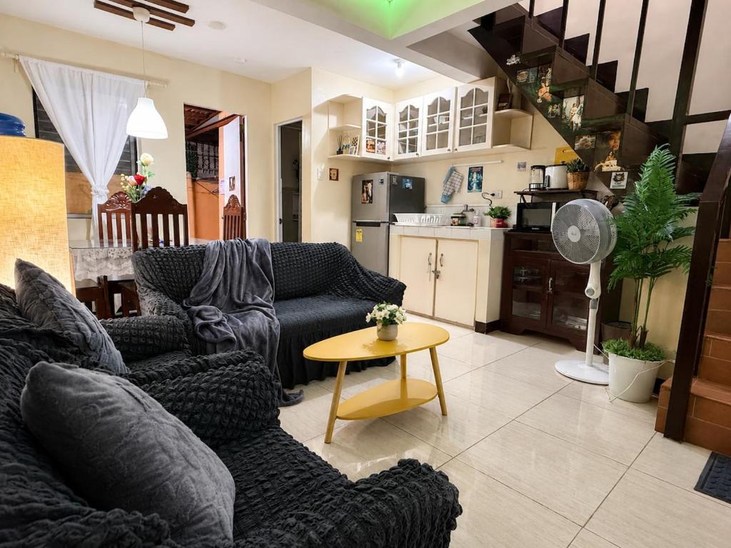 a living room with a couch and a table at Fantasia House General Santos in Lagao II