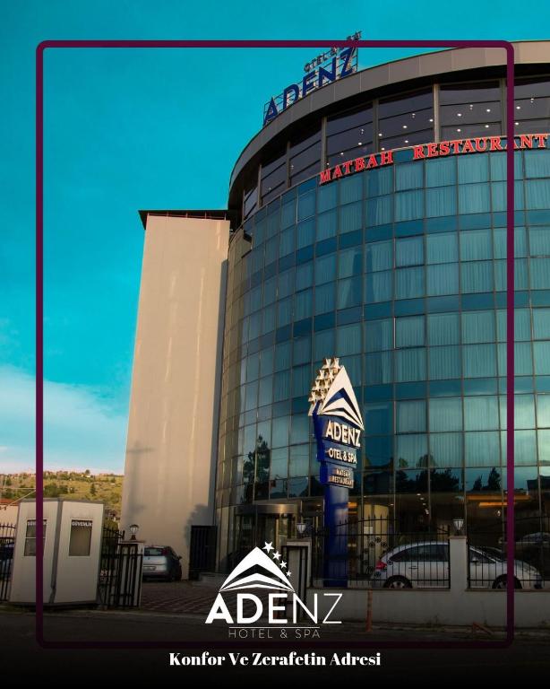 a building with a sign in front of it at Adenz Otel in Elmadağ
