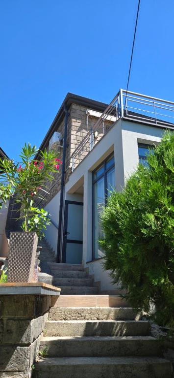 a house with stairs leading up to it at Ararat Terrace House in Ashtarak