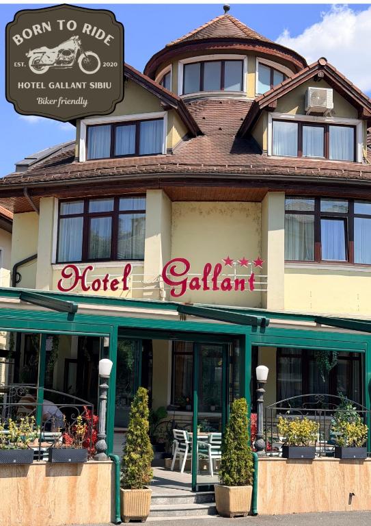 a hotel with a sign on the front of it at Hotel Gallant "Biker Friendly" in Sibiu
