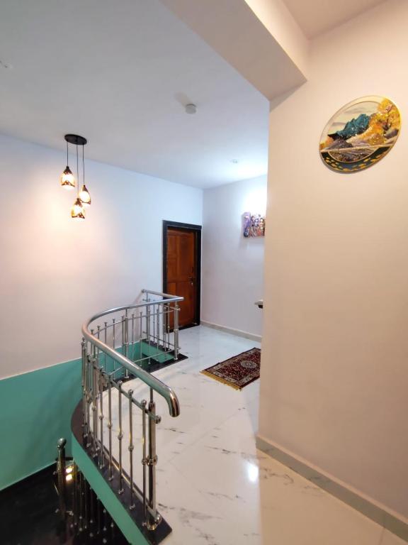 a staircase in a room with a stair case at Netra Kunj in Paliem