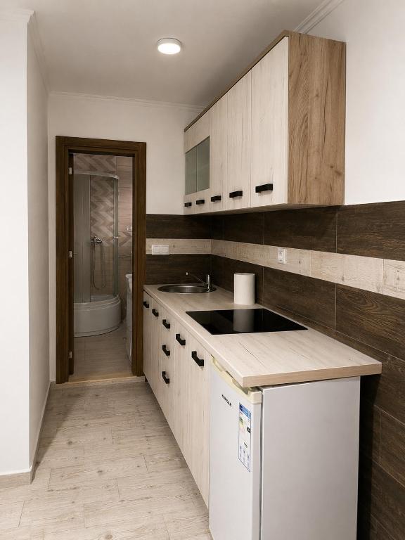 a kitchen with a sink and a toilet in a bathroom at Bayview in Grabe