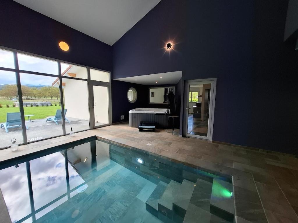 a house with a swimming pool in a room at Suite Romantique in Saint-Romans