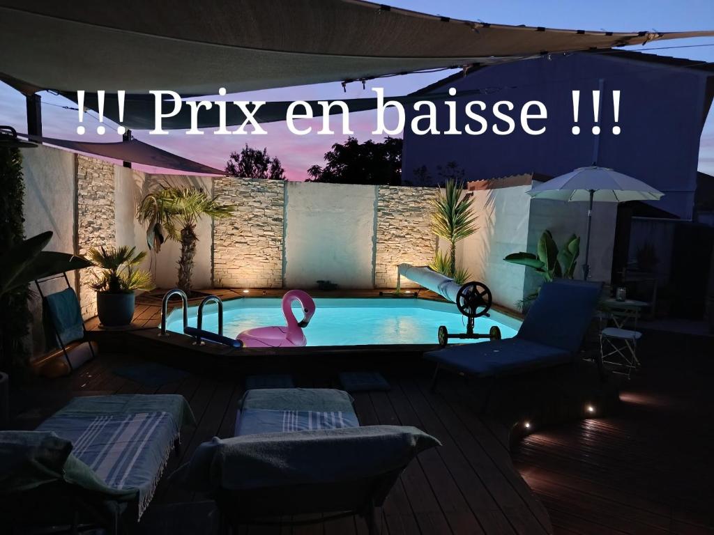 a swimming pool with a pink swan in it at Le petit coin de Provence in Beaucaire
