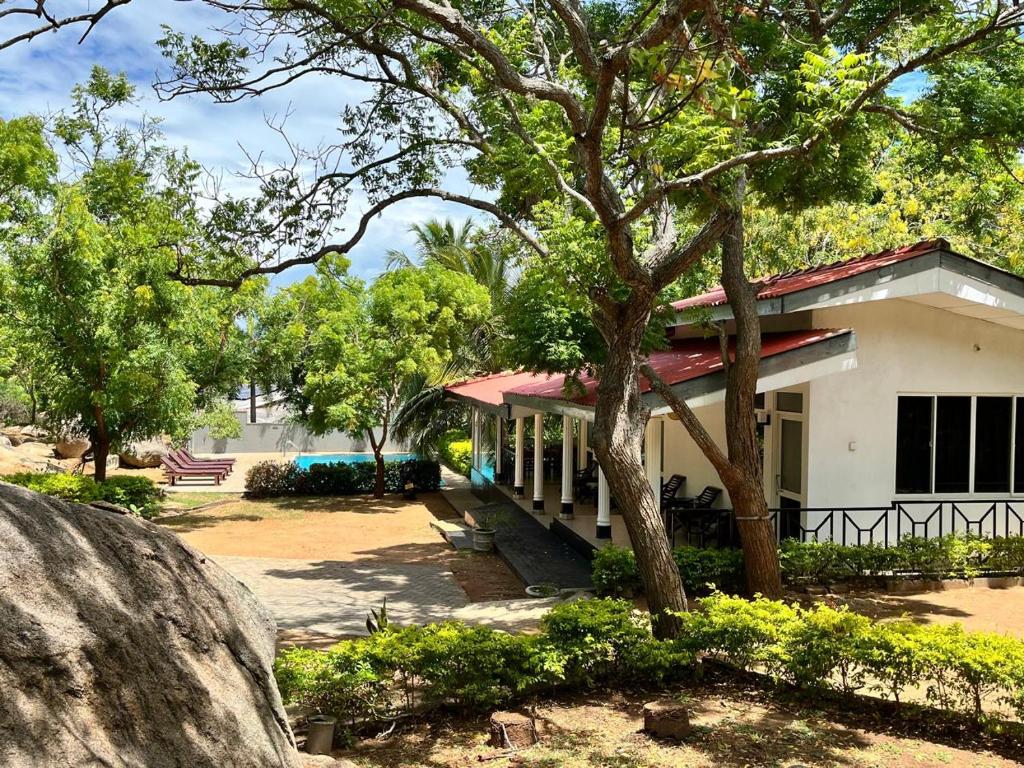 a house with a tree in front of it at The Rock Yala in Yala
