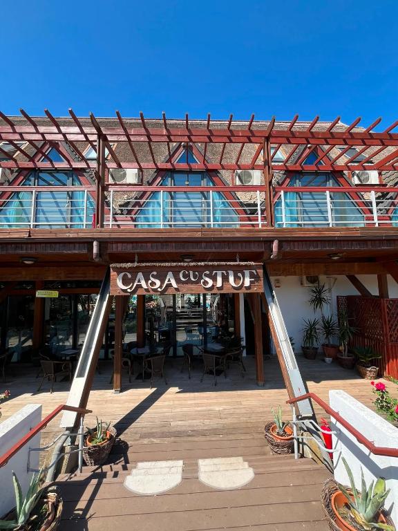 a building with a sign that reads casa cuisine at Casa cu Stuf Olimp in Olimp