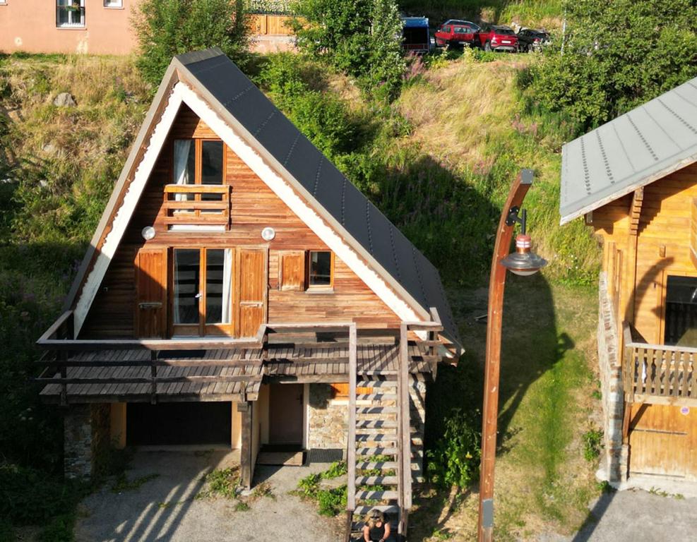 an overhead view of a house with a black roof at Chalet Pointu in Isola 2000