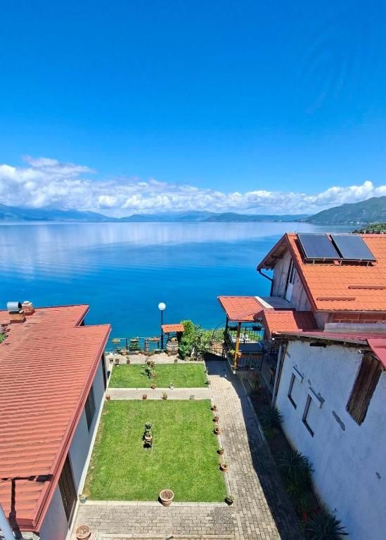an aerial view of a house with a view of the water at Apartments Viktor in Trpejca
