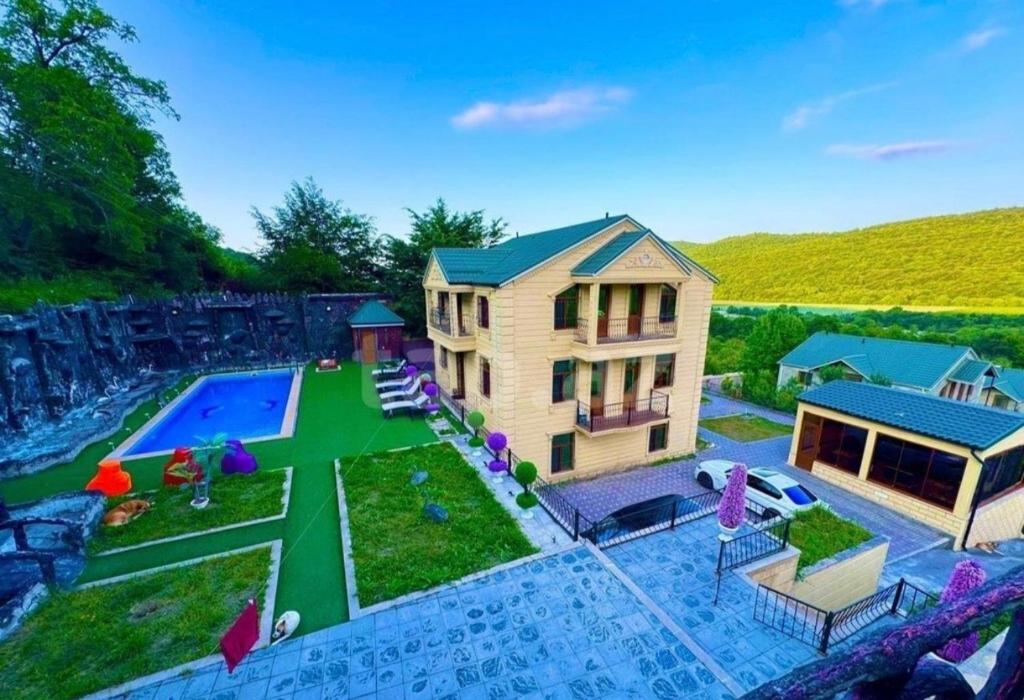 a model of a house with a swimming pool at Family Villa with Pool in Əski İqrığ