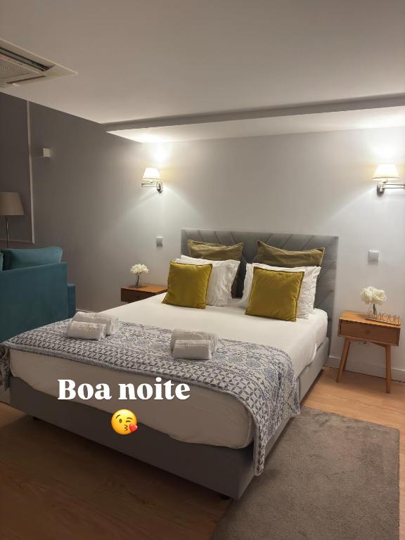 a bedroom with a bed with a box notice on it at Romantic Douro River & Sunset views in Porto