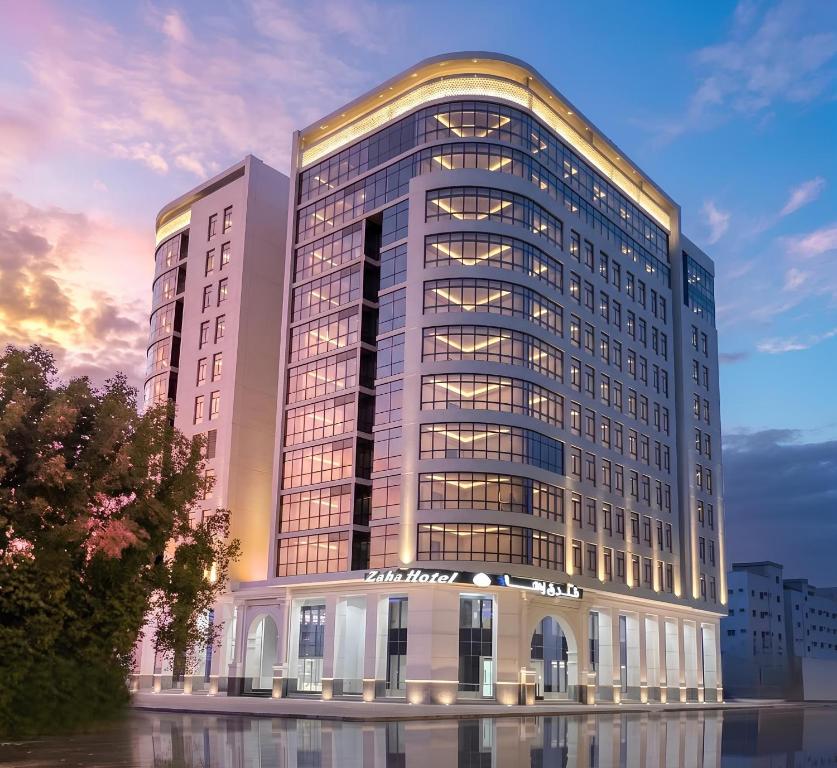 a rendering of a large office building with a sunset at Zaha Taiba Hotel in Medina