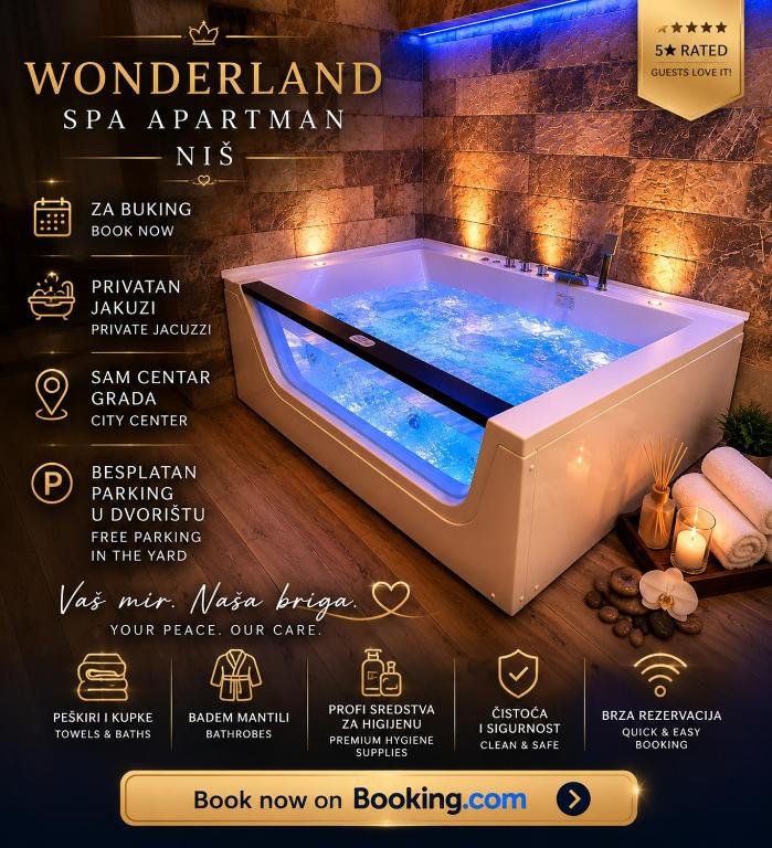 a hot tub in a bathroom with a sign that reads wonderland spa apartmentkun at Wonderland spa free parking in Niš
