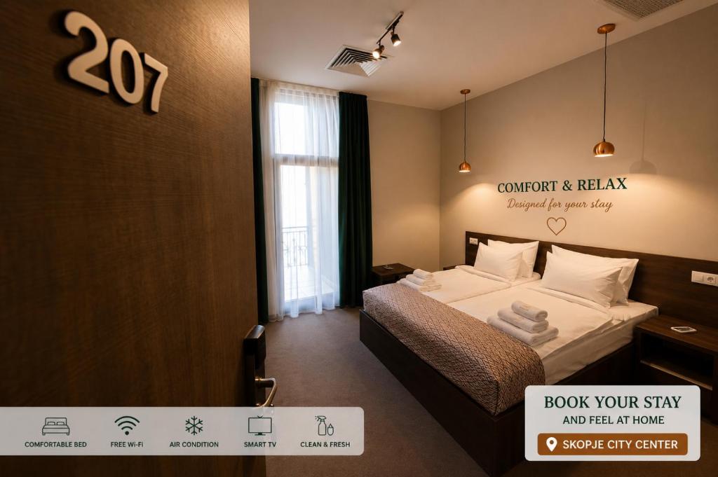 a bedroom with a bed and a sign on the wall at Hotel Cara 28 in Skopje