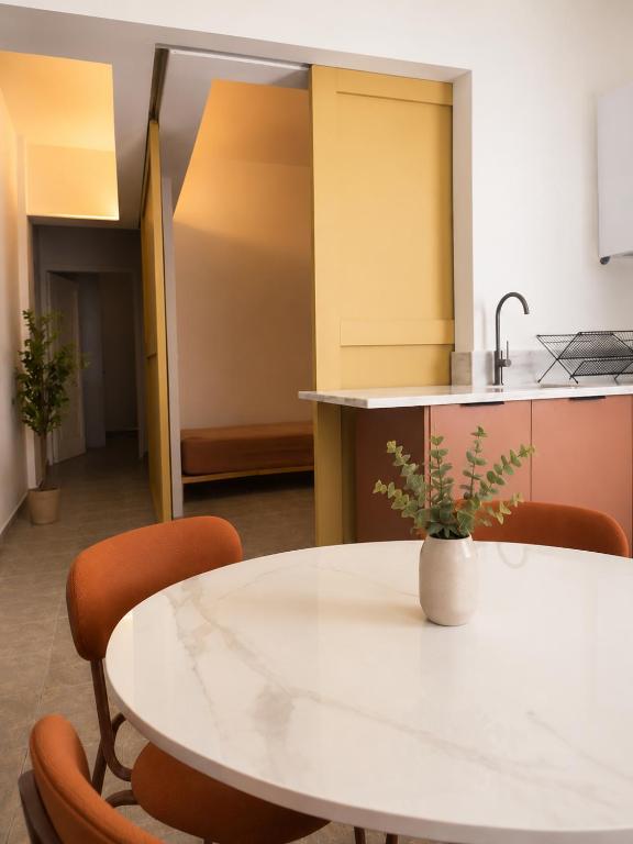 an office with a white table and chairs at Noéma Mani Boutique Residences in Gythio