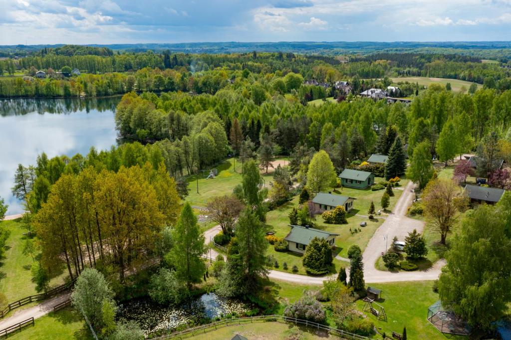 an aerial view of a park with a lake at Zielone Wzgórza in Bytów