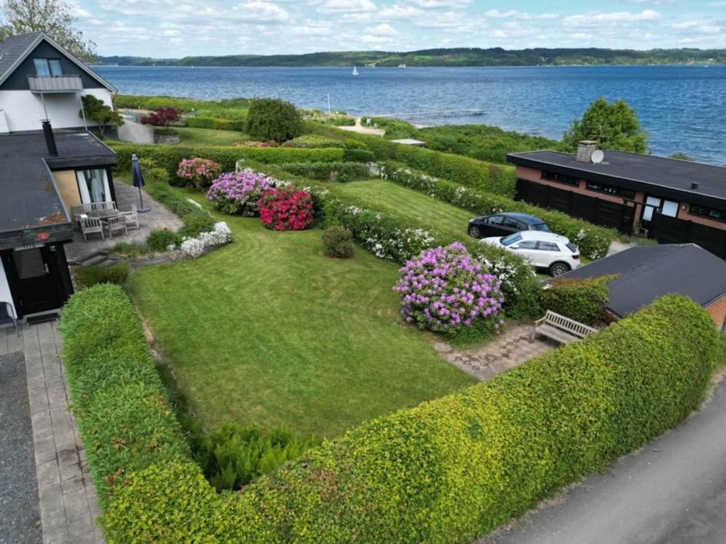 an aerial view of a garden with flowers and a house at 6 person holiday home in Børkop in Børkop