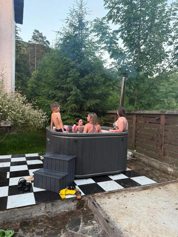 a group of people in a hot tub at Hotel palas tatarıv in Tatariv