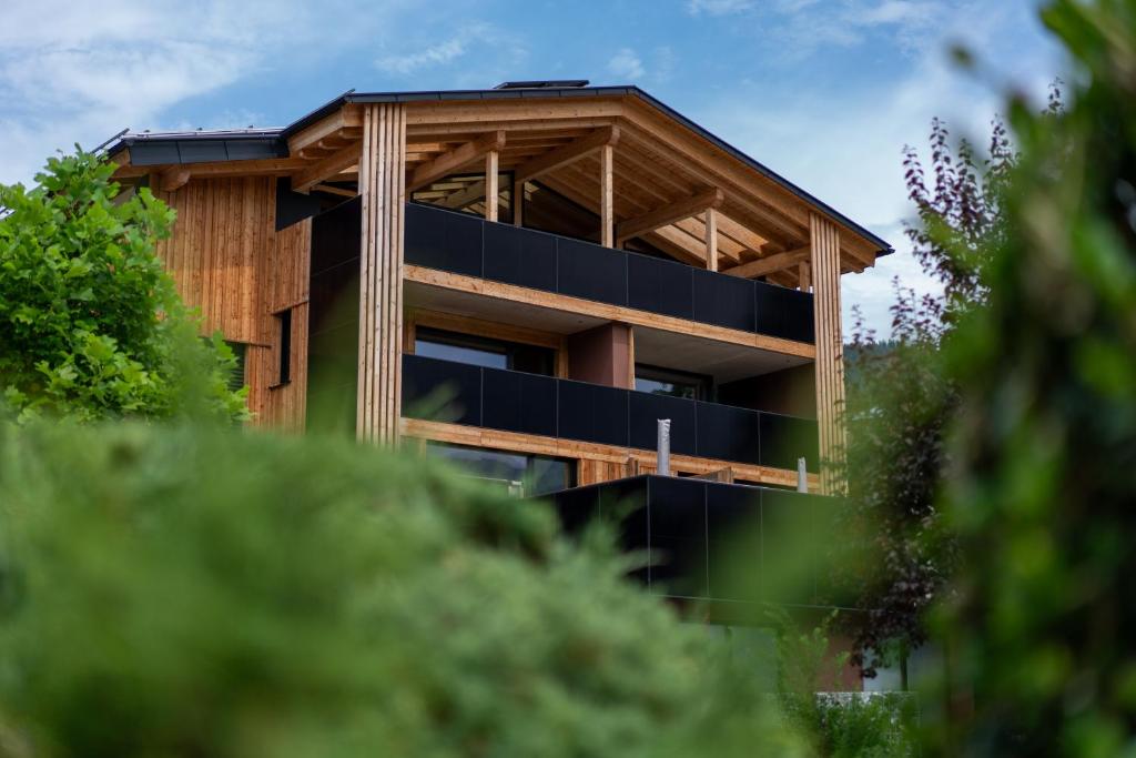 a house with a solarium on the side of it at Lodge 53 in Breitenwang