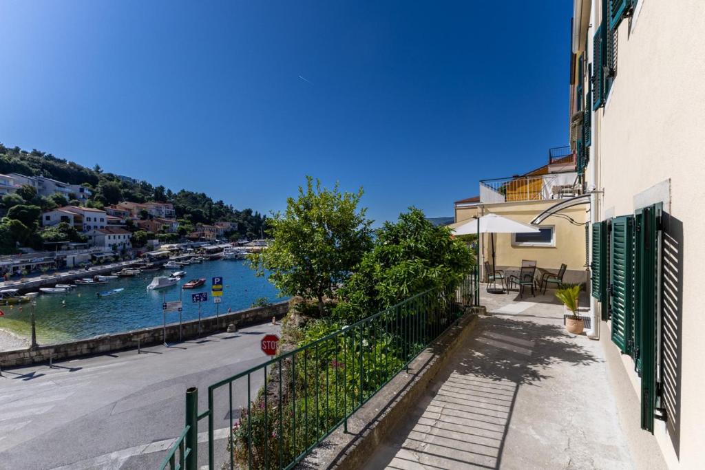 a view of a river with boats in the water at Apartment Mare - Beachfront in Rabac